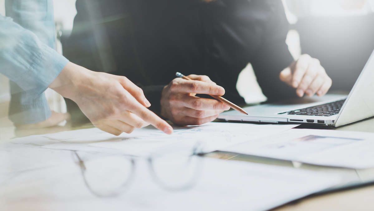 Client reviewing tax planning paperwork at a desk